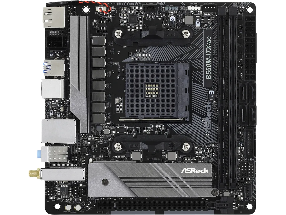 Green mini-ITX board with silver heatsinks and rear I/O shield