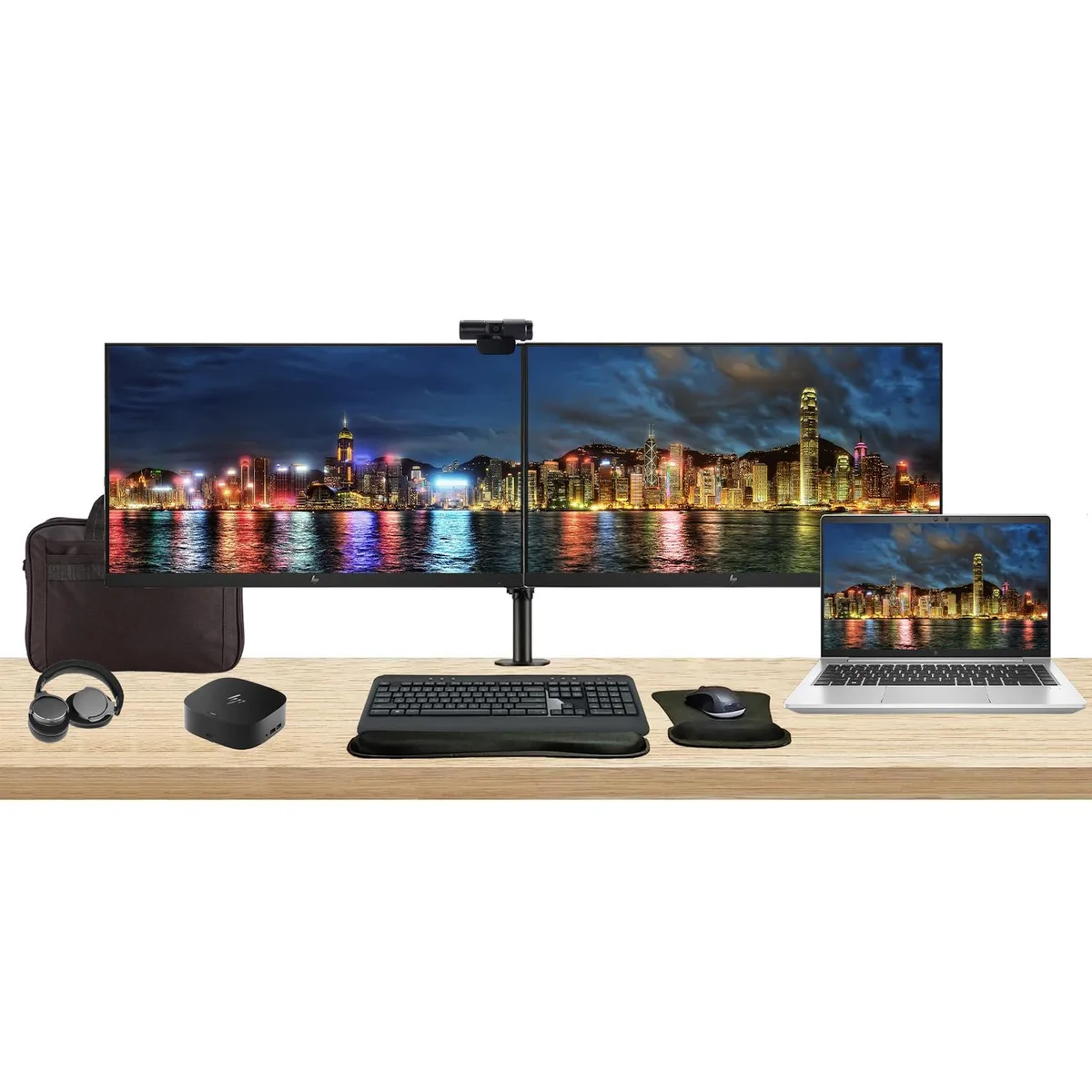 A silver 14 inch laptop, two 27 inch monitors on a dual arm stand, a compact dock, wireless keyboard and mouse, webcam