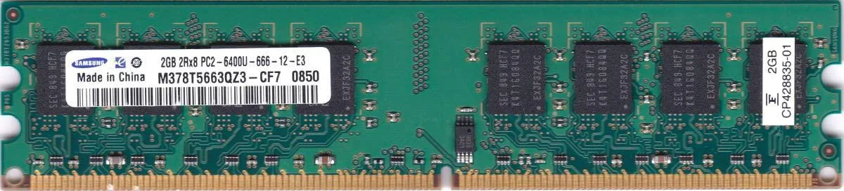 Green rectangular circuit board with black memory chips and gold edge connector