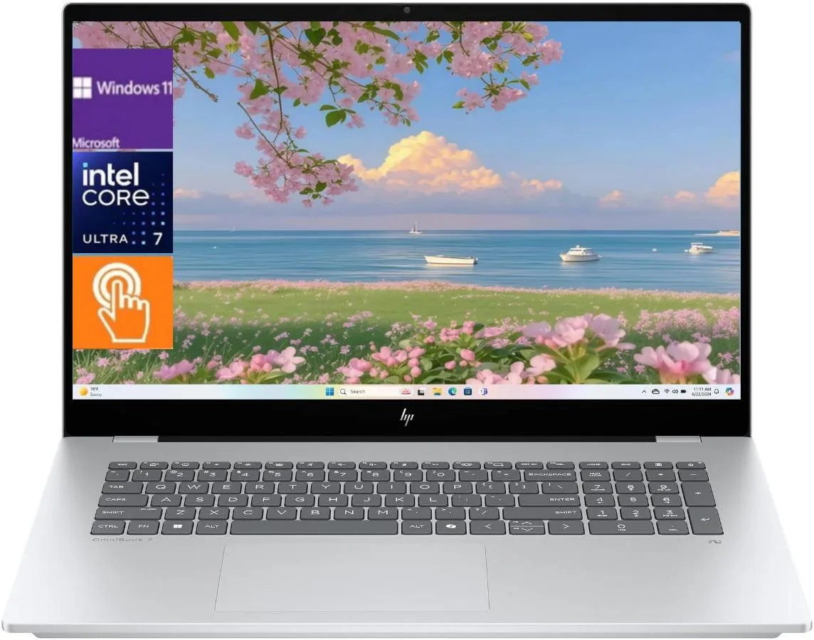 Silver 17.3 inch touchscreen laptop with edge-to-edge glass display, backlit keyboard and numeric keypad