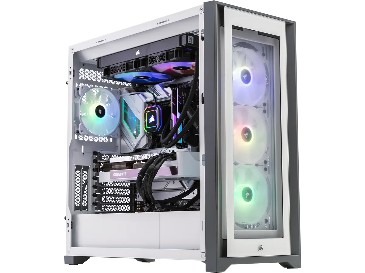 White mid-tower gaming PC with tempered glass panels and RGB lighting visible inside