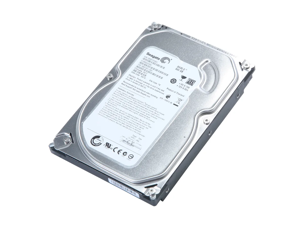 Silver 3.5 inch bare hard drive with circuit board visible