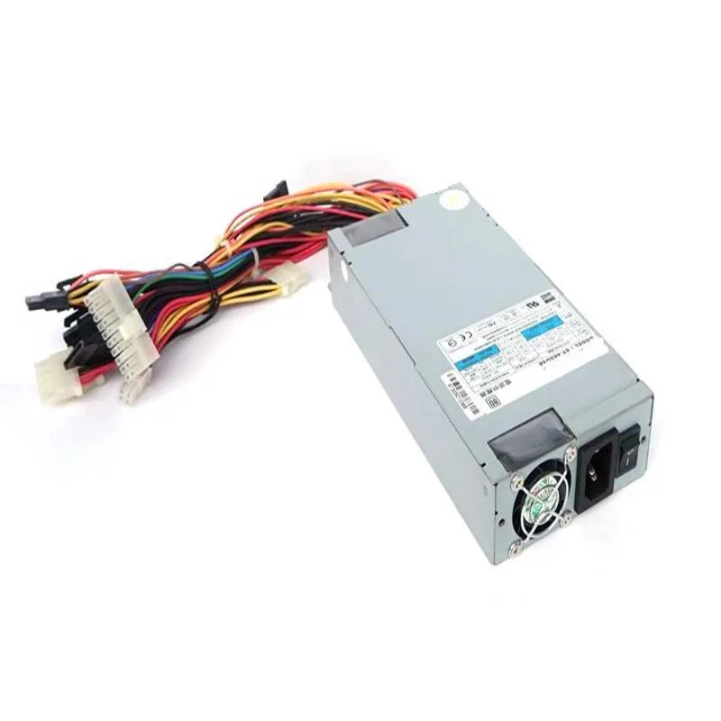 Rectangular silver metal ATX power supply unit with fan grille
