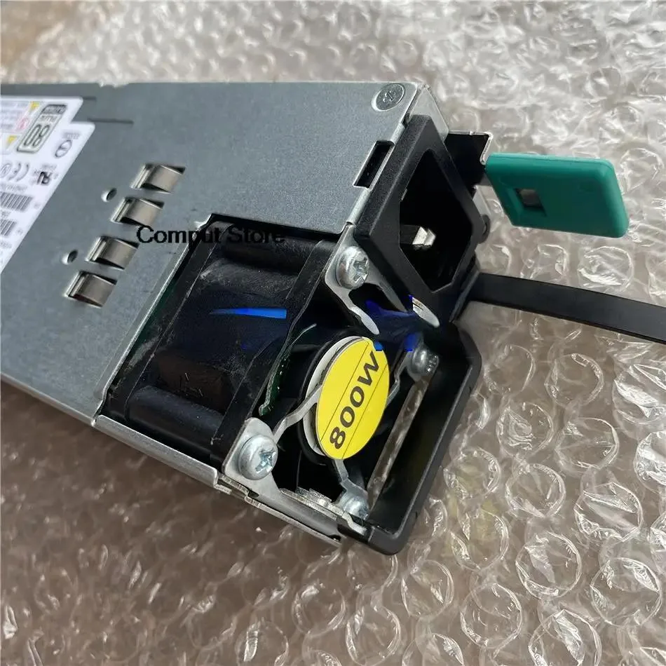 Rectangular silver server PSU with hot-plug handle and rear fan grille