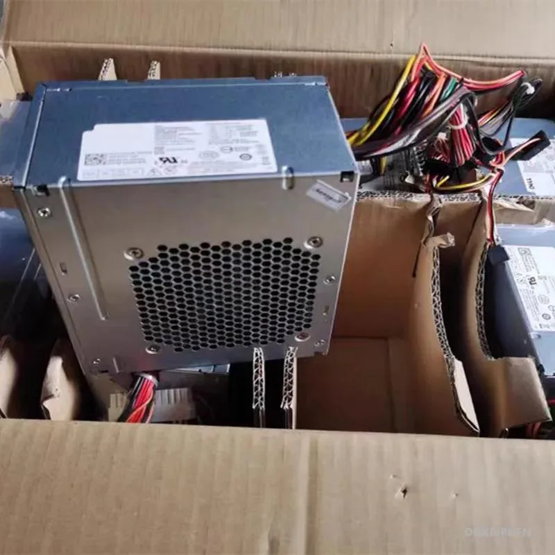 Silver rectangular ATX power supply unit with gold certification badge and cooling fan grille
