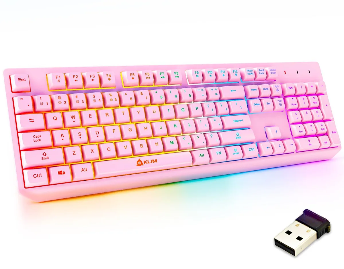 Pink wireless gaming keyboard with RGB backlighting, membrane keys, compact rectangular shape, matte finish, USB receiver included