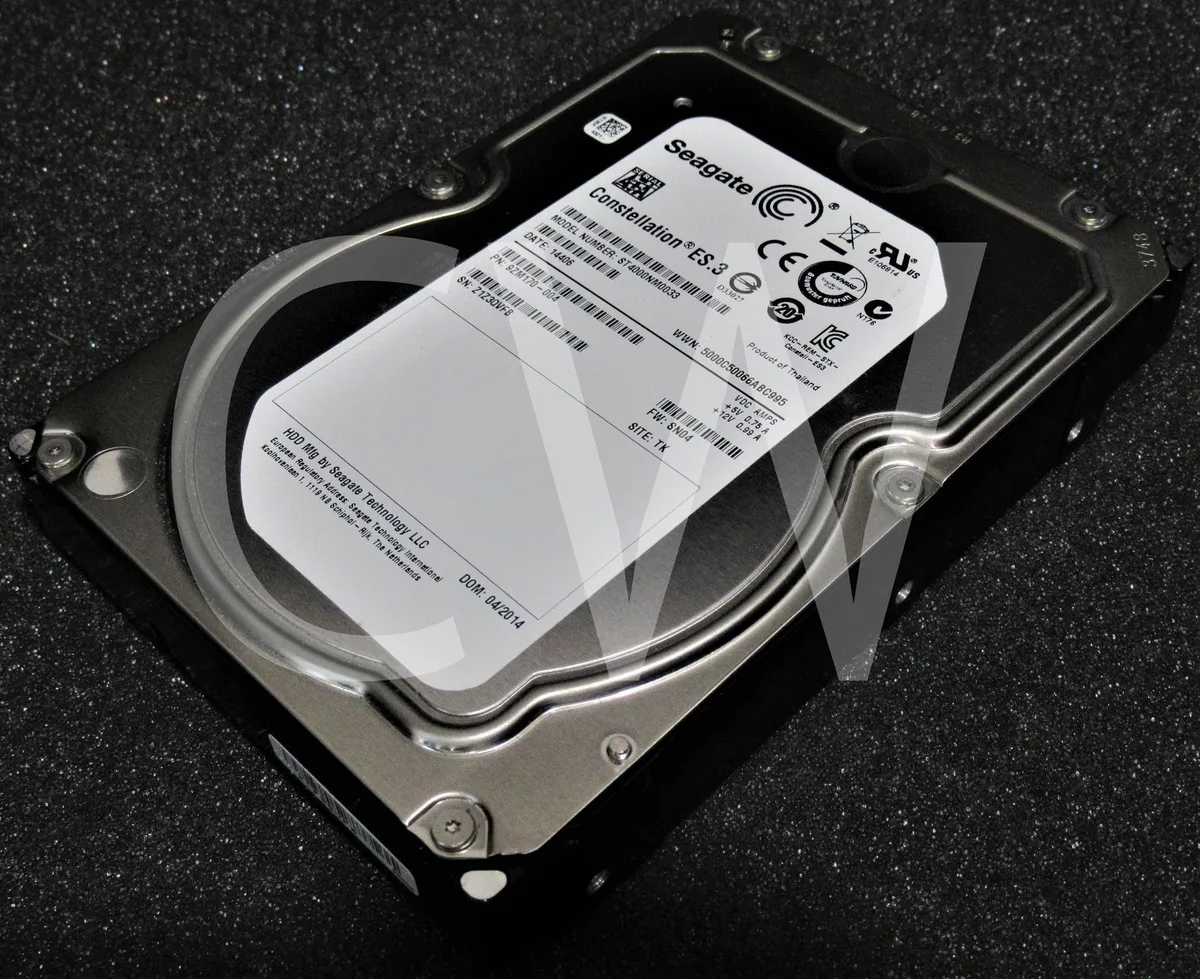 Silver 3.5 inch bare hard drive with exposed circuit board
