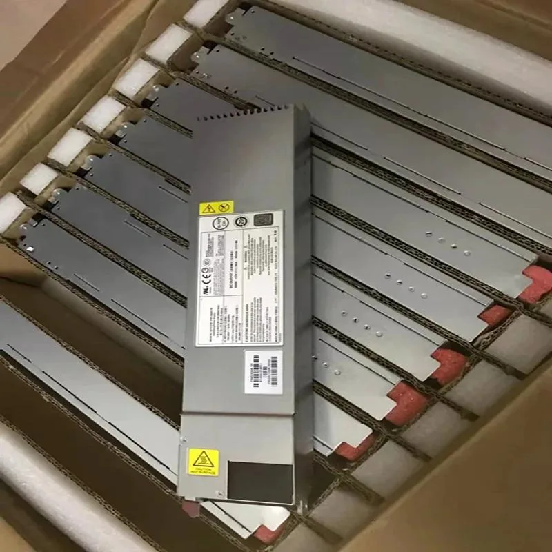 Silver rectangular ATX power supply unit with fan grille and power socket