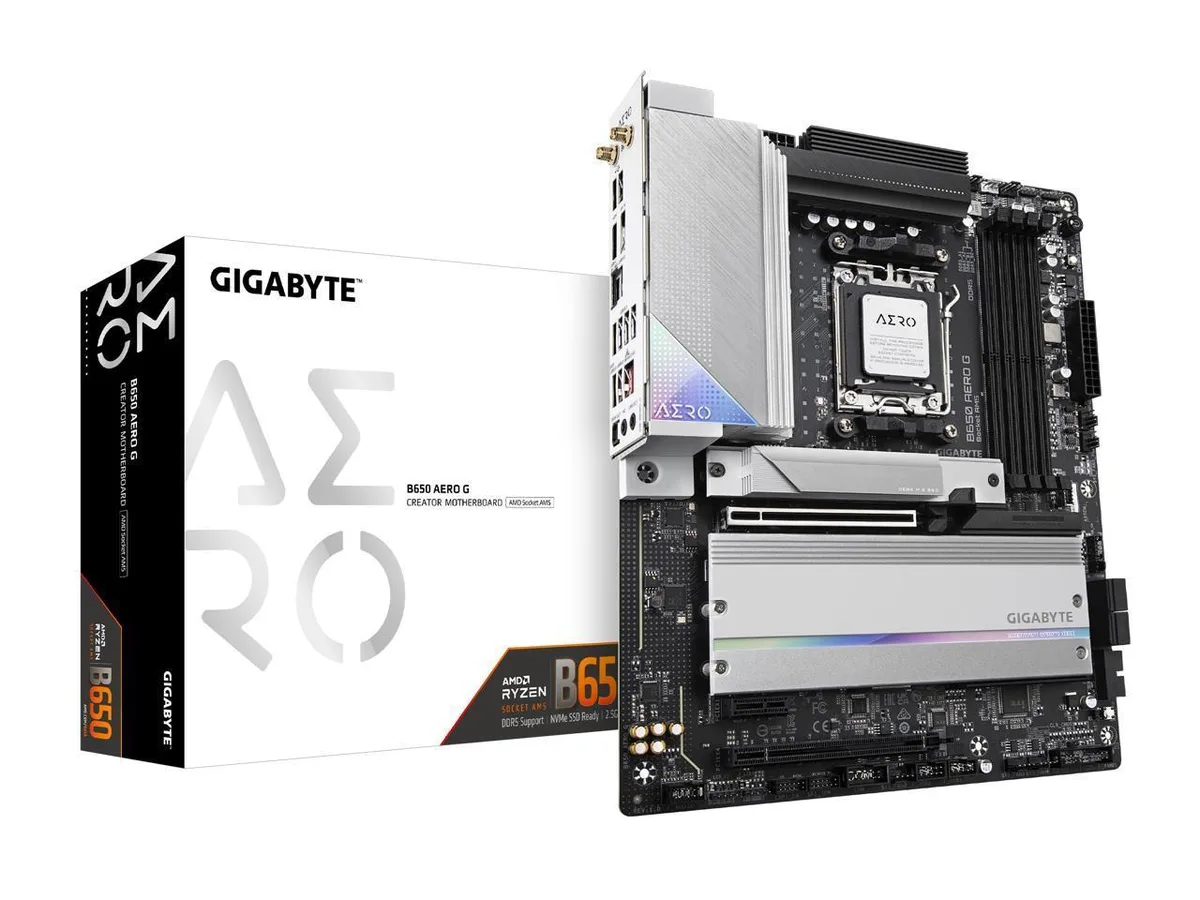 ATX motherboard with silver and white heatsinks and black PCB