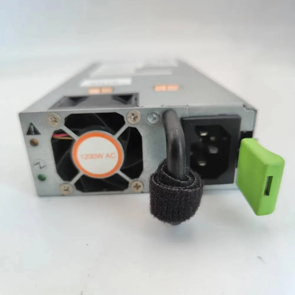 Rectangular silver metal ATX power supply unit with ventilation grille and rear power socket