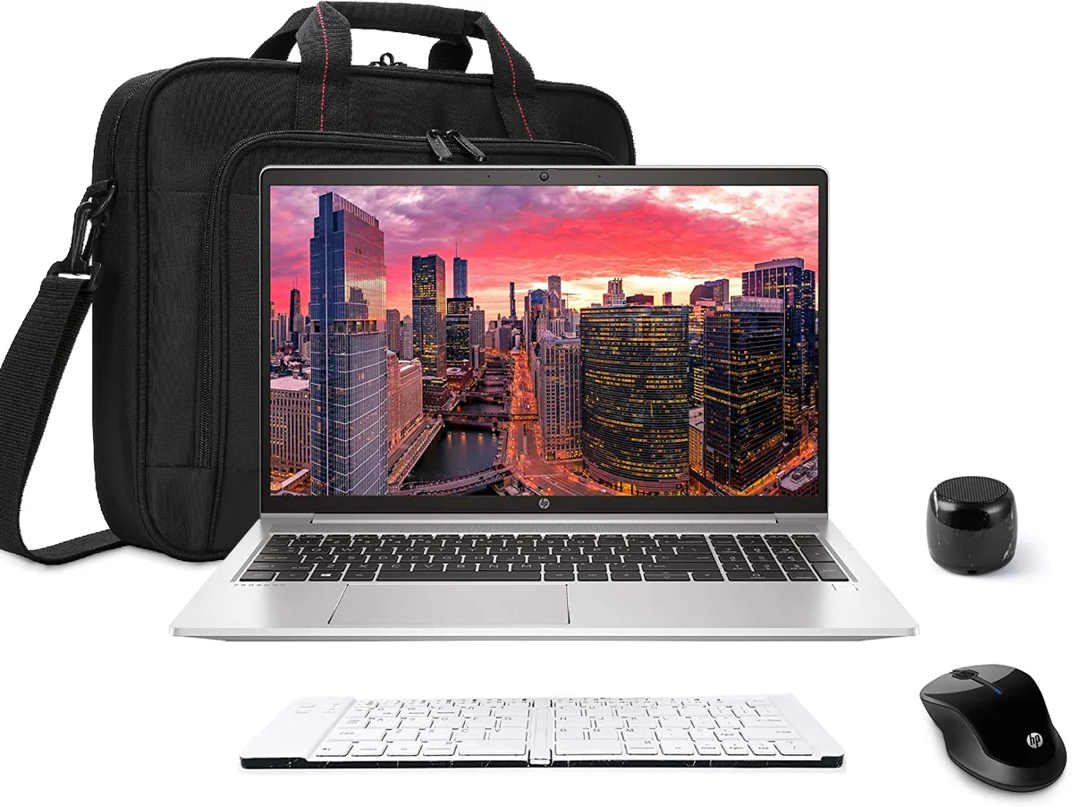 Silver 15.6-inch touchscreen laptop with matching mouse, compact speaker, folding keyboard and carry bag