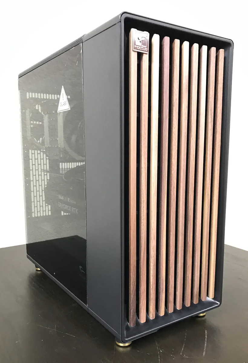 Fractal Design North mid-tower in black with walnut accents, tempered glass side panel, Noctua fans and cooler visible inside