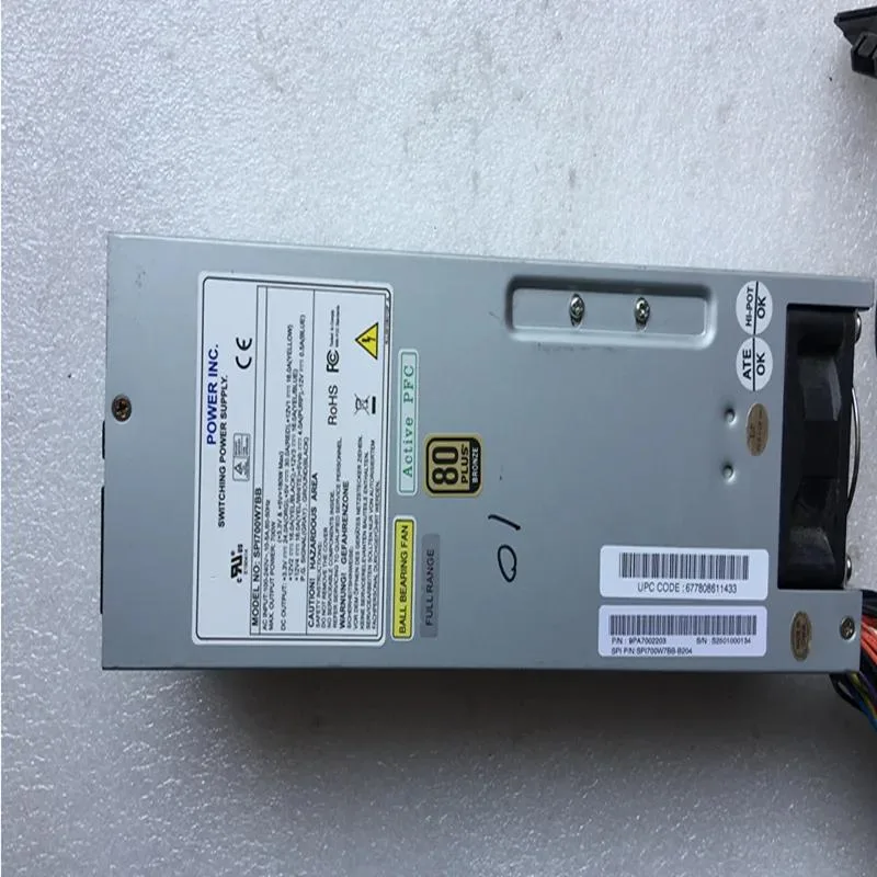 Rectangular black ATX power supply unit with fan grille and cable bundle