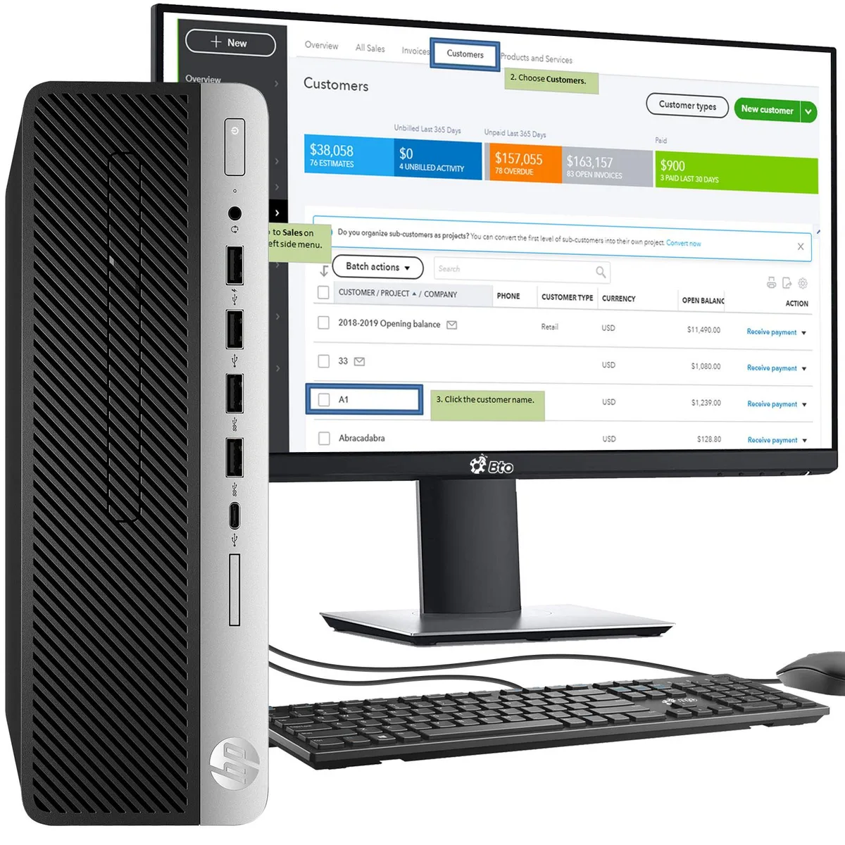 Black small-form-factor desktop tower with a 24-inch monitor, wired keyboard and mouse