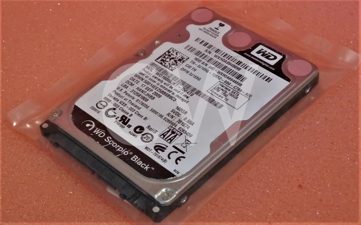 Silver 2.5 inch SATA hard drive with circuit board visible