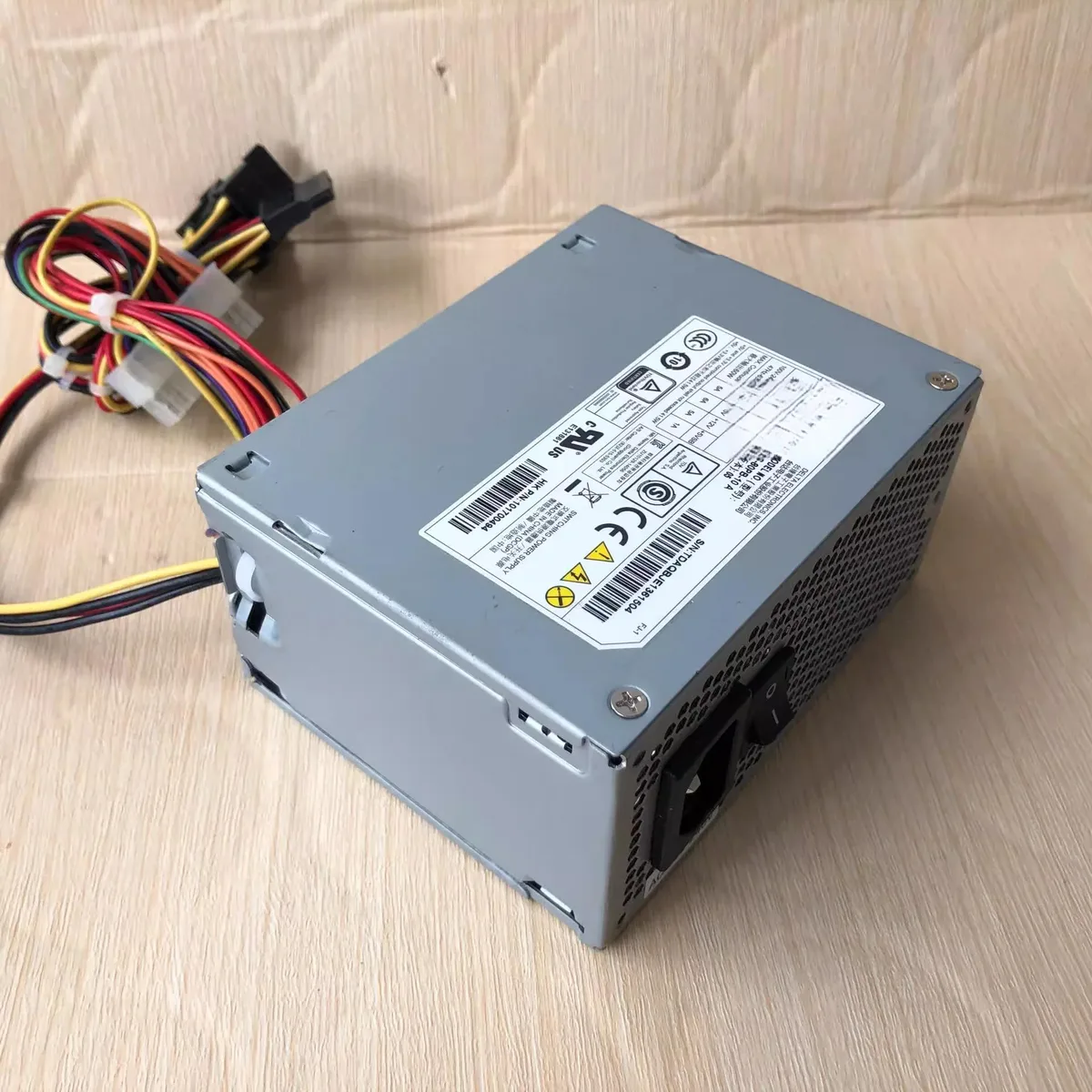 Rectangular metal ATX power supply unit with four output ports