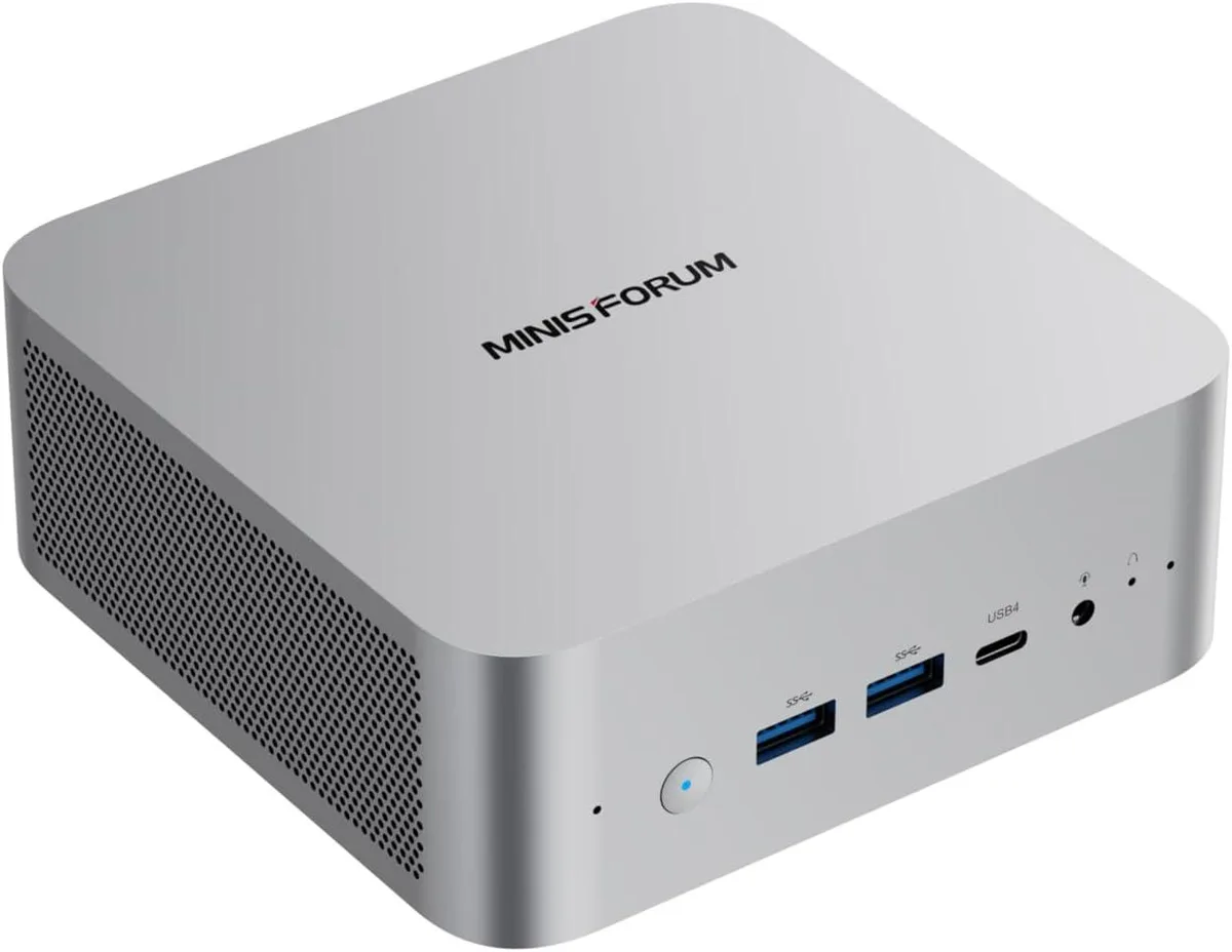 Silver mini PC barebone, compact square chassis, front ports visible