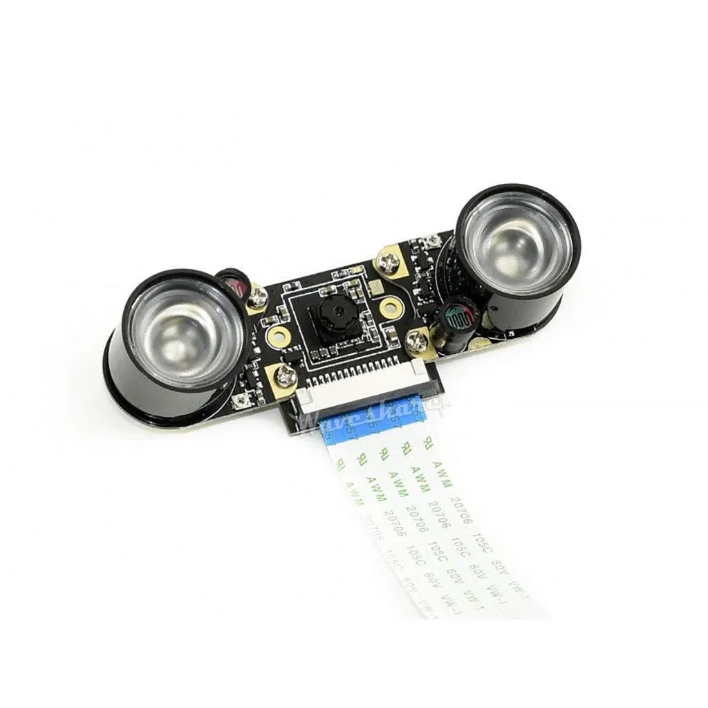 Small green circuit board 25 by 24 mm with a tiny camera lens and four corner mounting holes