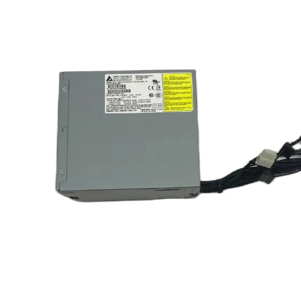 Rectangular metal ATX power supply unit with ventilation grille and label showing part numbers