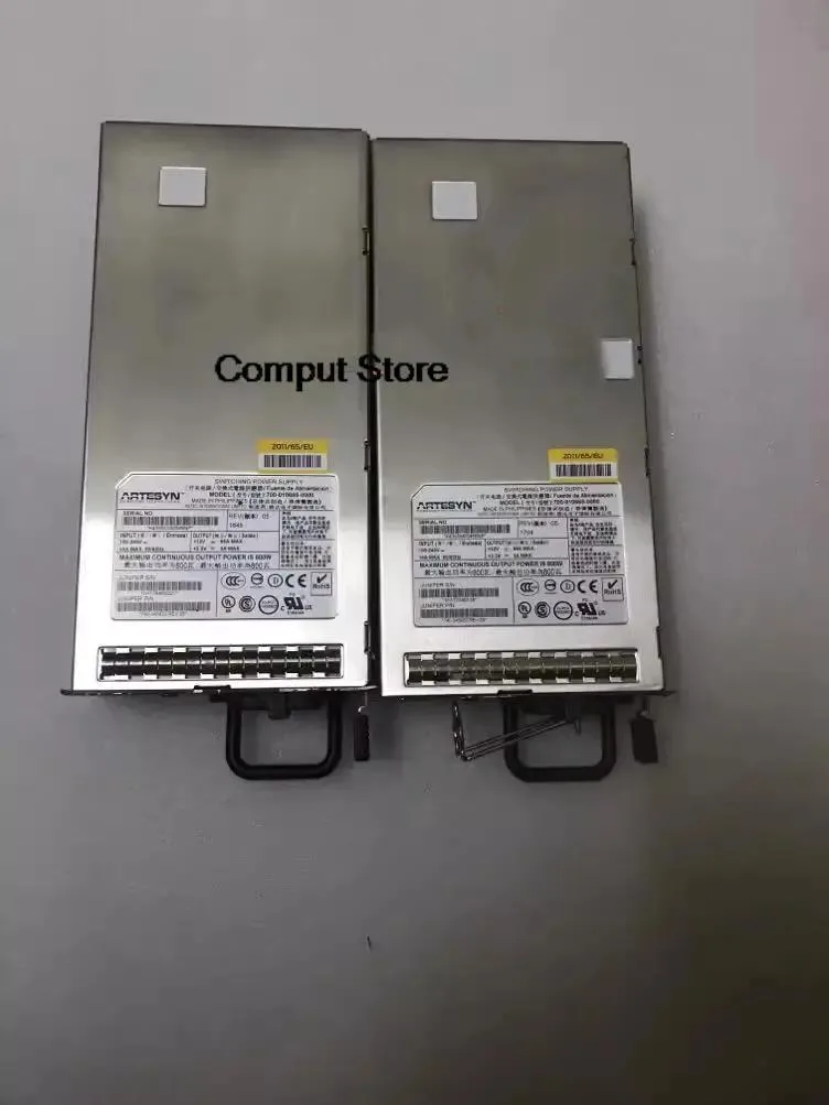 Silver metal ATX power supply unit with ventilation grille and label showing model numbers