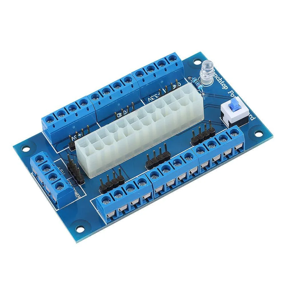 Green rectangular circuit board with 24-pin ATX connector and screw terminals