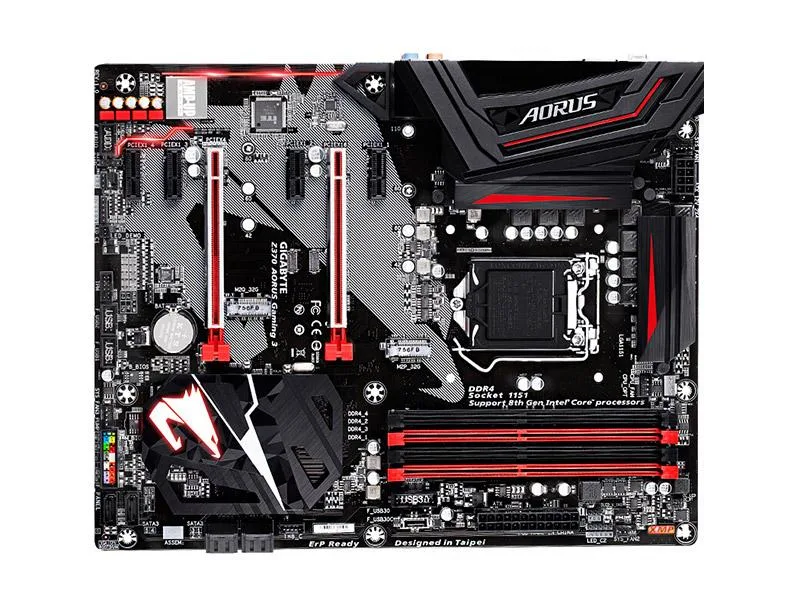 Rectangular ATX motherboard, dark PCB with silver heatsinks and black slots