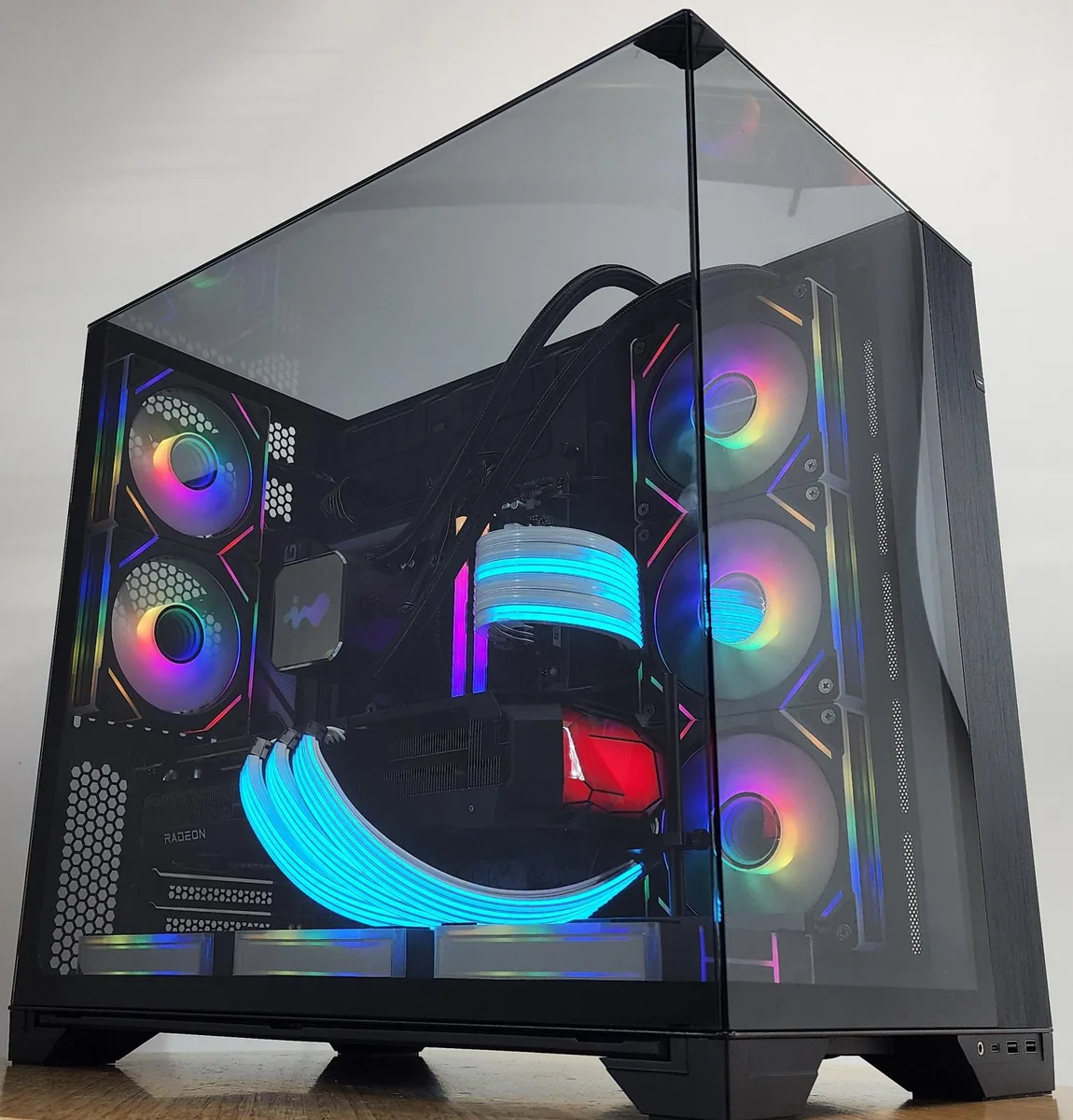 Black Lian Li O11 Vision case with 360mm RGB AIO cooler and RX 9070 XT graphics card visible through tempered glass panels