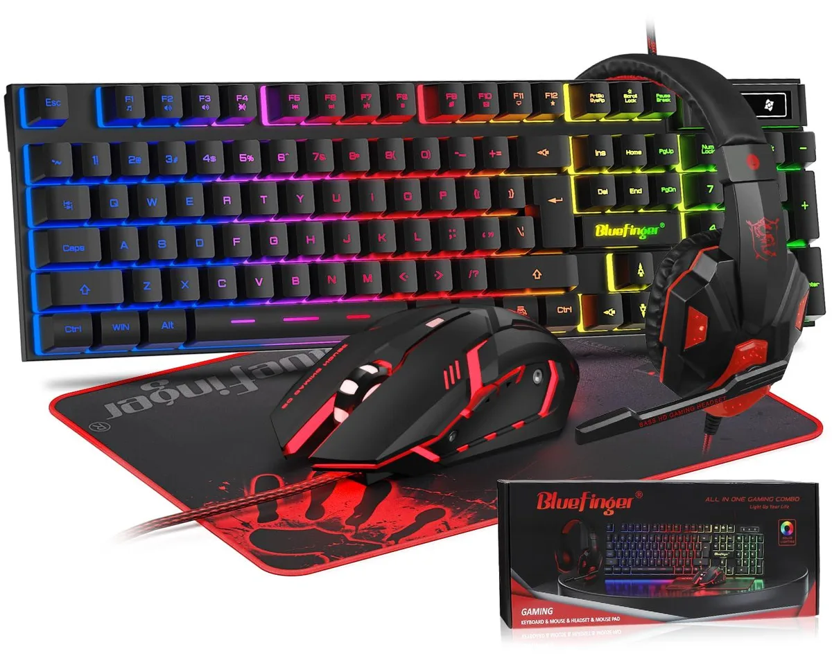 Black 104-key keyboard, wired mouse and red headset on desk