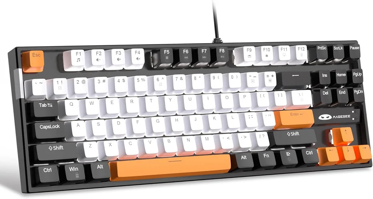Compact 75 percent mechanical keyboard in white and black with orange accent keycaps and white LED backlighting