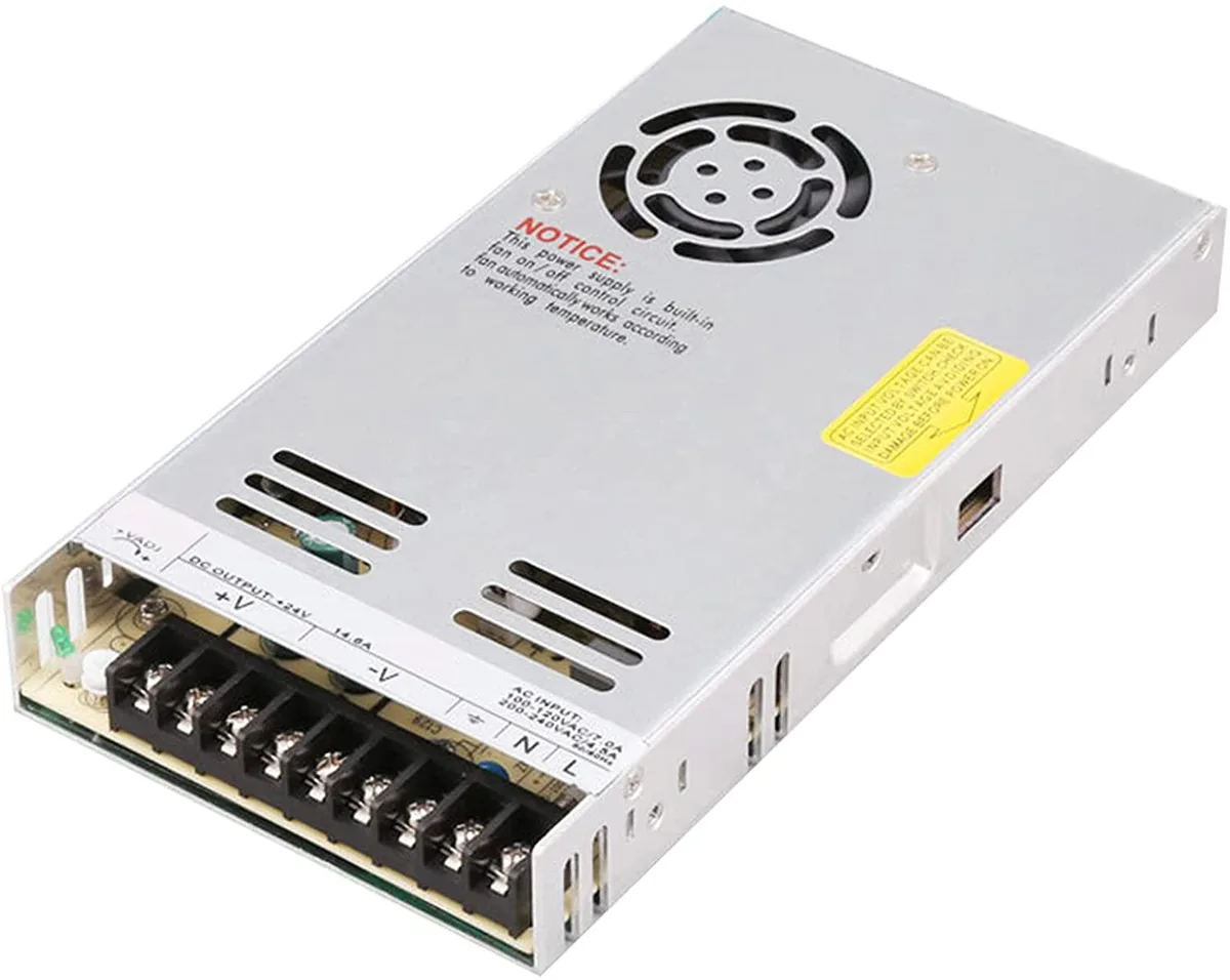 Rectangular silver metal power supply unit with ventilation slots and terminal connections