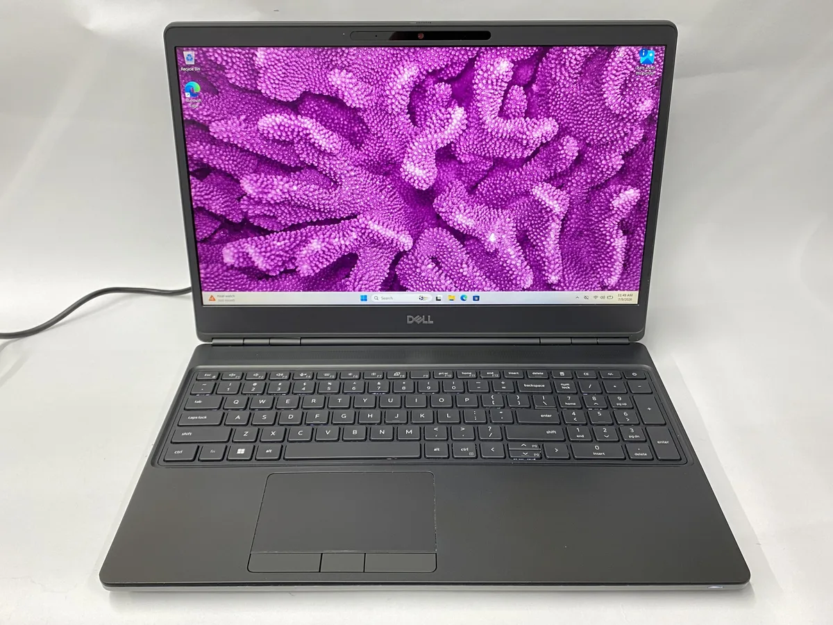 Silver Dell Precision 7560 laptop, 15.6 inch screen, sticker burn on lid, scratches on case