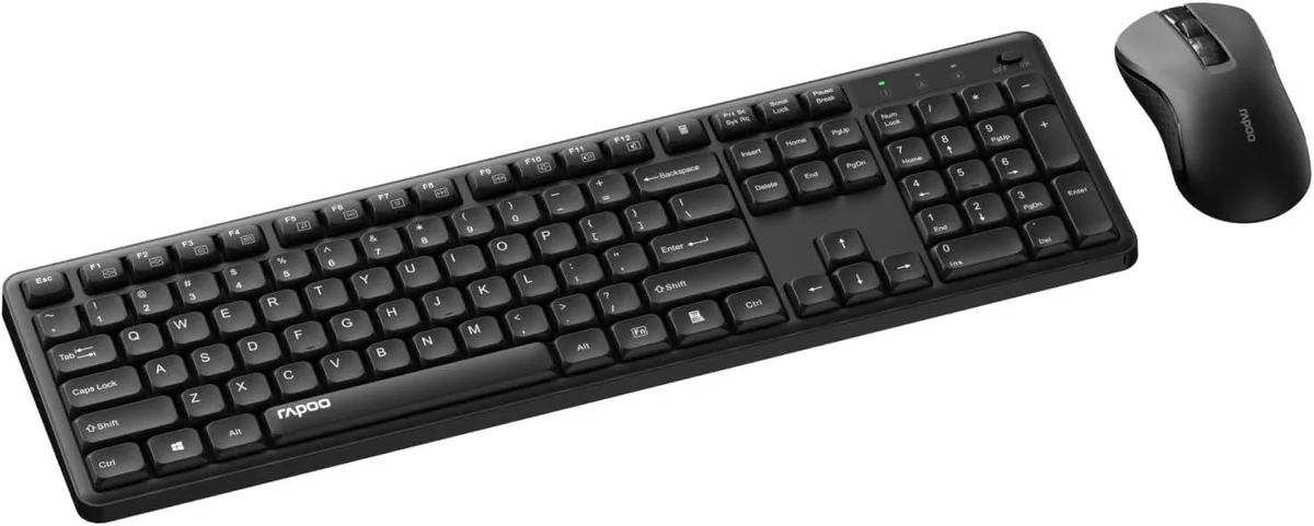 Black full-size wireless keyboard with low-profile keys and matching compact mouse, USB receiver shown