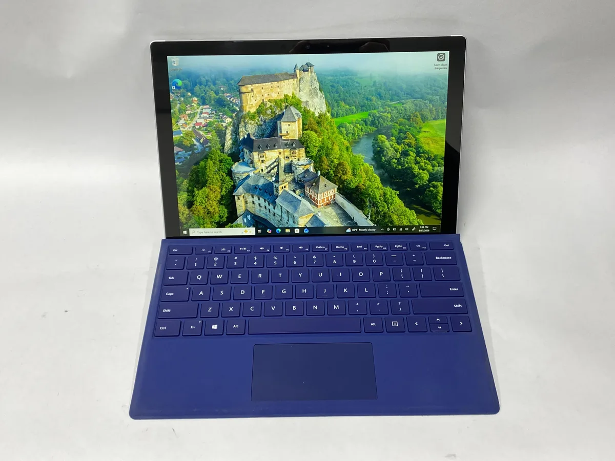 Silver 12 inch tablet with kickstand and detachable keyboard