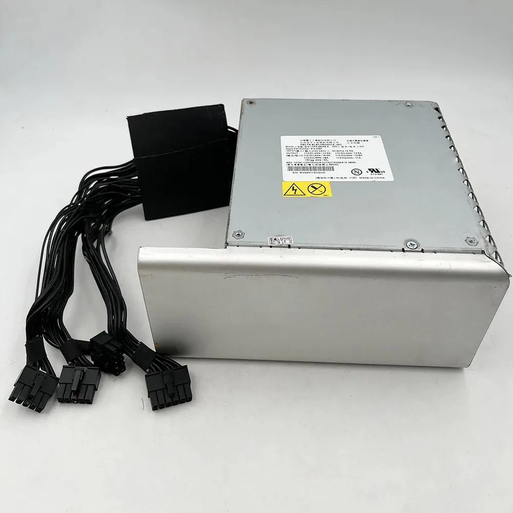 Rectangular silver ATX power supply unit with ventilation grille and label showing 980W