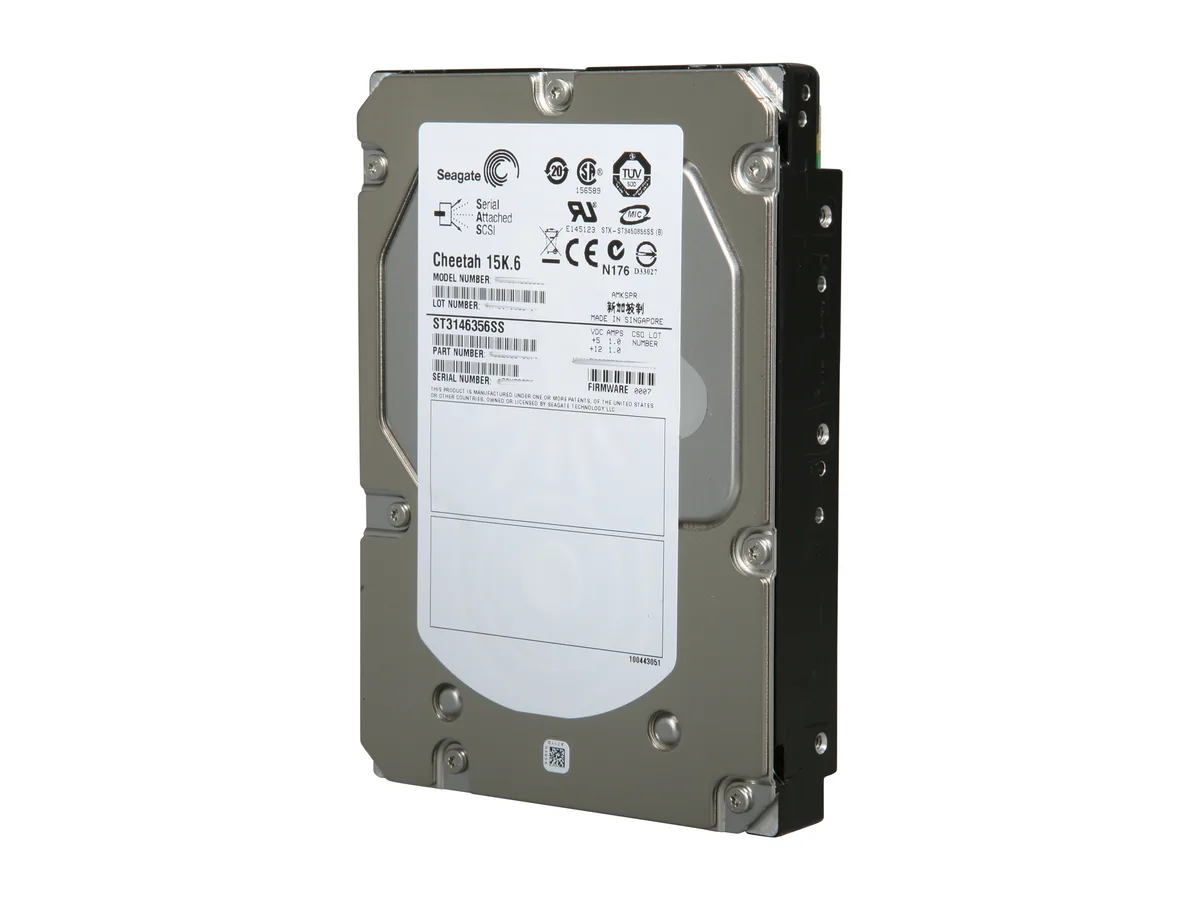 Silver 3.5 inch bare hard drive with green circuit board exposed