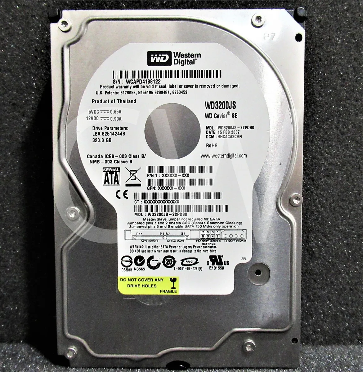 Silver 3.5 inch SATA hard drive with circuit board visible