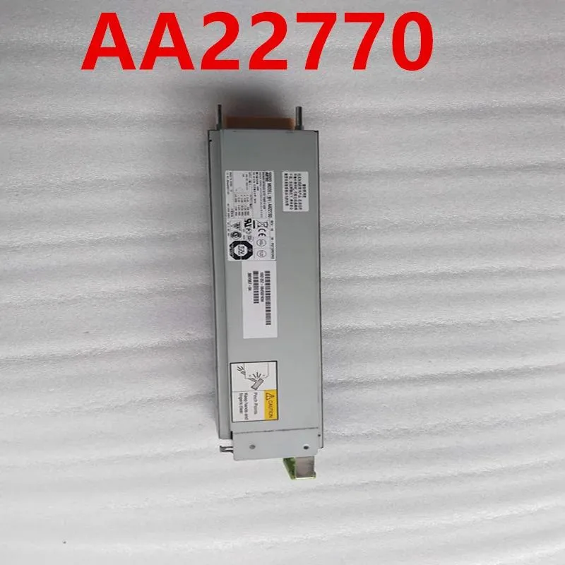 Silver rectangular ATX power supply unit with ventilation grille and label showing model numbers