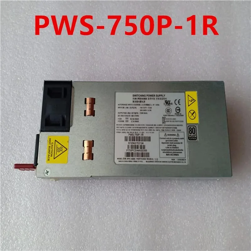 Rectangular silver metal power supply unit with fan grille and label showing 750W