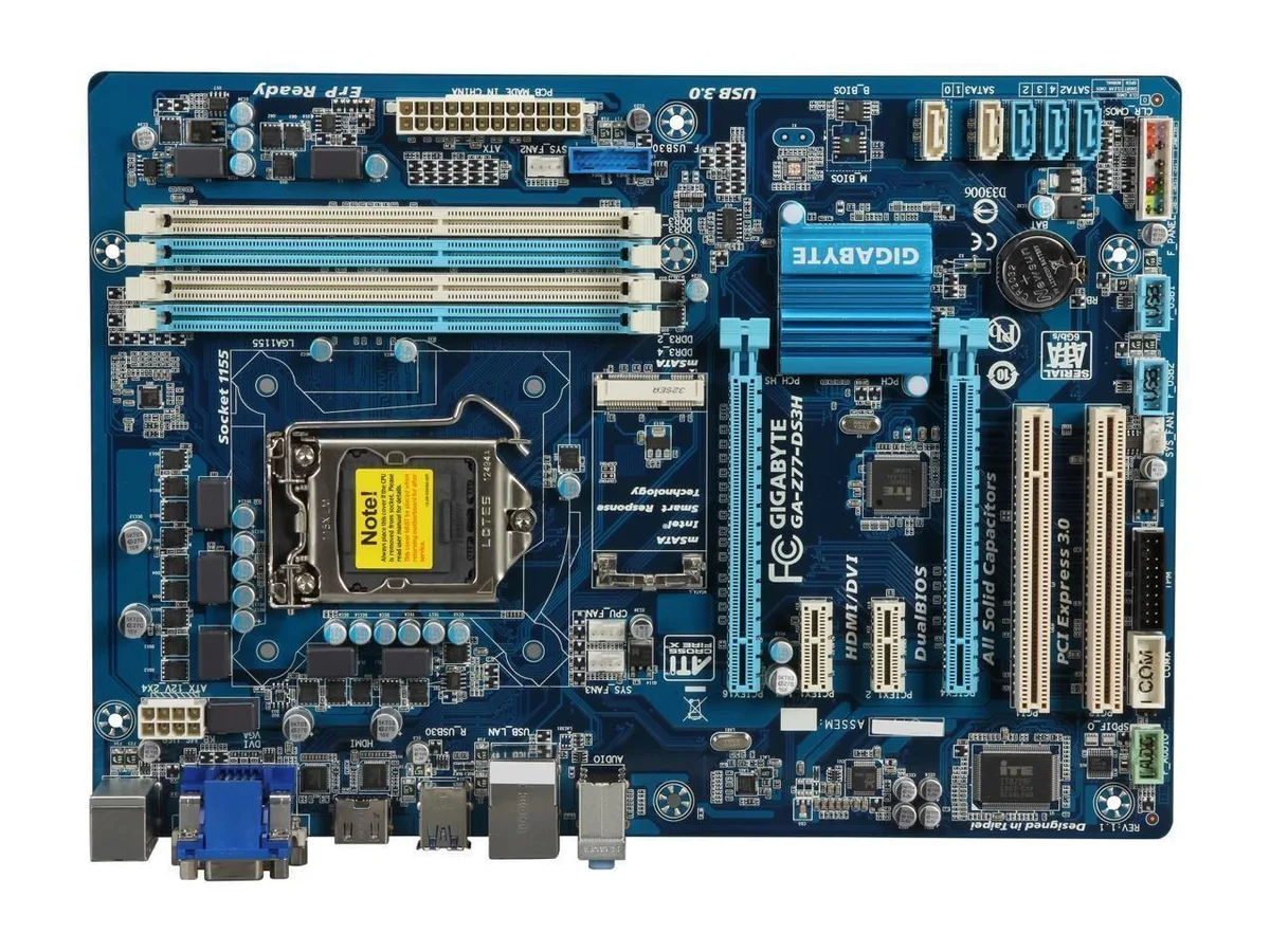 Green ATX motherboard with silver heatsinks and black expansion slots
