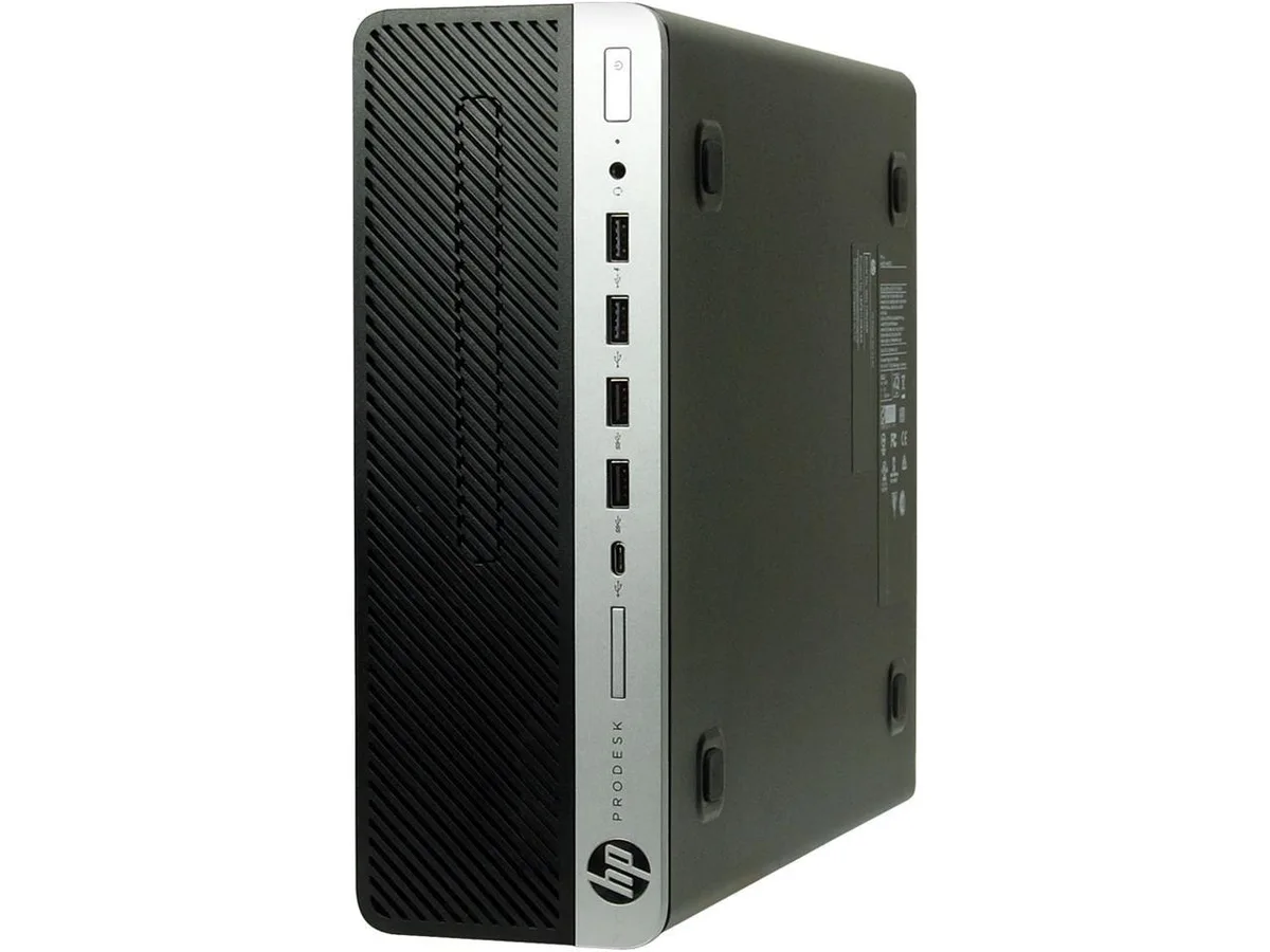 Black and silver small form factor desktop tower with keyboard mouse and WiFi adapter