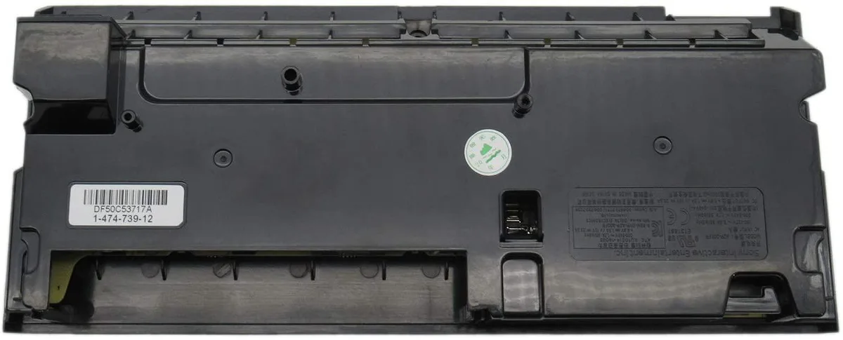 Black rectangular power supply module with vented sides and connector panel, approximately 483 grams
