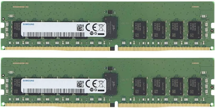 Two green rectangular RAM sticks with gold connectors and black chips