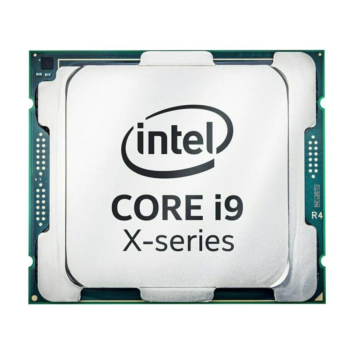 Square metallic CPU with gold contacts on green substrate, silver integrated heat spreader engraved with model details