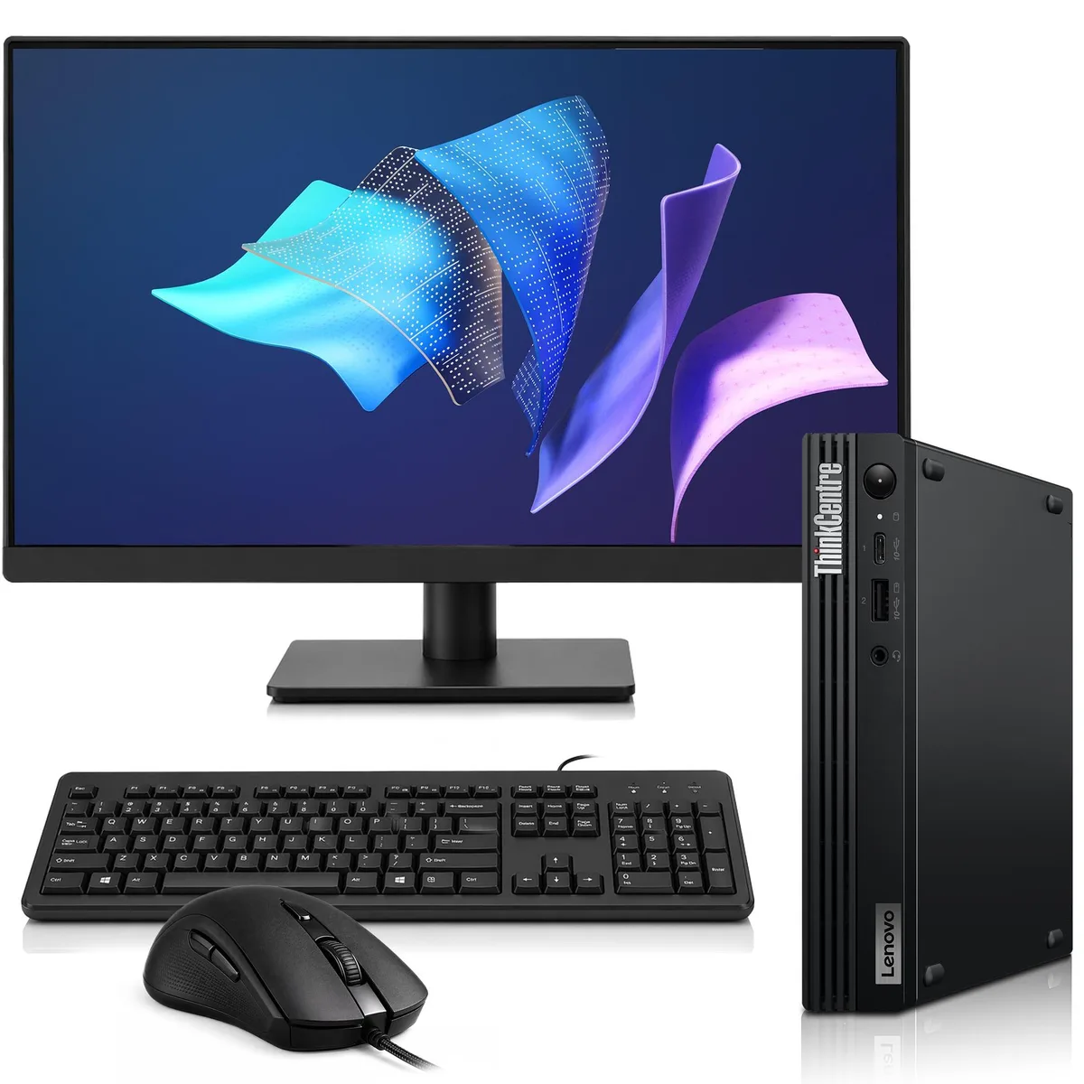 Small black Lenovo mini desktop beside 24 inch monitor with keyboard and mouse