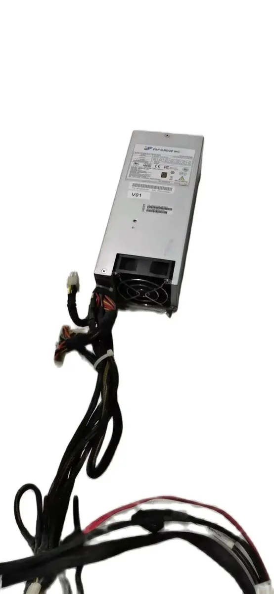 Rectangular silver ATX power supply unit with fan grille and connector sockets
