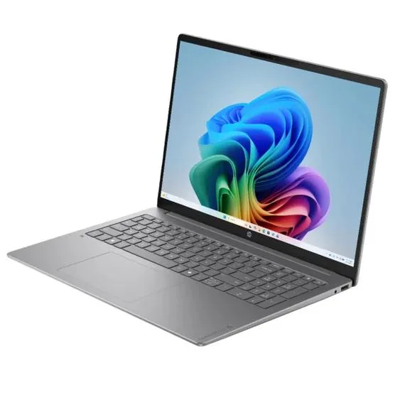 Silver 16-inch touchscreen laptop with backlit keyboard and numeric keypad
