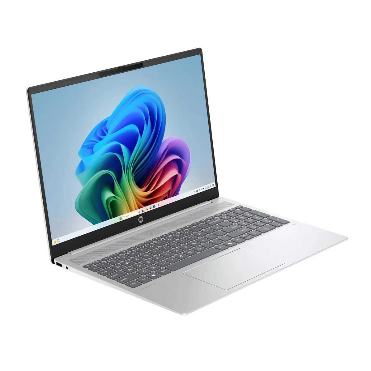 Silver 16-inch laptop with numeric keypad and backlit keyboard
