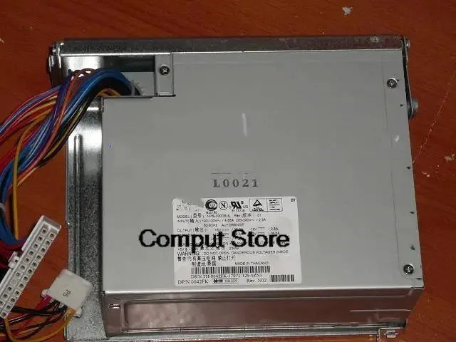 Rectangular silver ATX power supply unit with fan grille and power socket