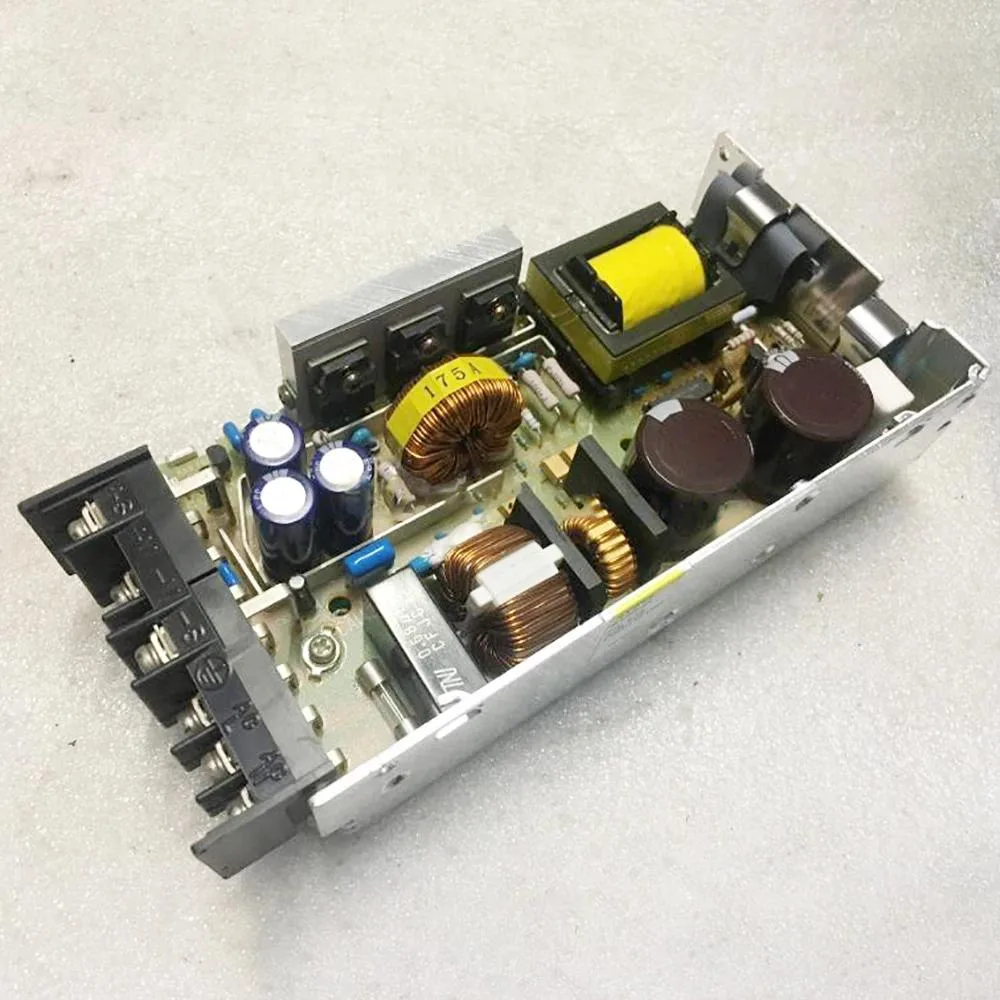 Silver ATX power supply unit with label showing 24V 65A 150W