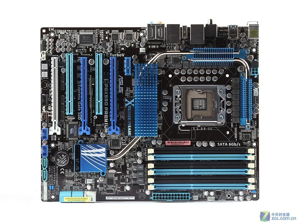 Green ATX motherboard with black sockets and silver heatsinks